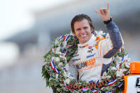 INDIANAPOLIS, IN - FILE: Dan Wheldon of England, driver of the #98 William Rast-Curb/Big Machine Dallara Honda gestures to photographers during the 95th Indianapolis 500 Mile Race Trophy Presentation at Indianapolis Motor Speedway on May 30, 2011 in Indianapolis, Indiana. Wheldon died today, October 16, 2011 in Las Vegas, Nevada during the IZOD IndyCar World Championships when his car was involved in a 15-car wreck. (Photo by Nick Laham/Getty Images)
