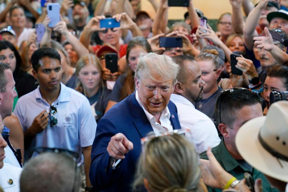 Republican presidential candidate Donald Trump greets supporters during a visit to the Iowa State Fair on 12 August (AP)