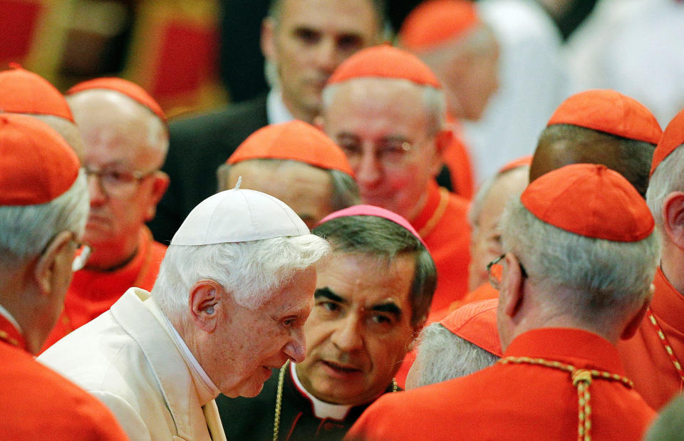 Pope Emeritus Benedict XVI is greeted by Cardinals as he arrives to attend a consistory ceremony in Saint Peter's Basilica at the Vatican February 22, 2014. / Credit: Max Rossi / REUTERS