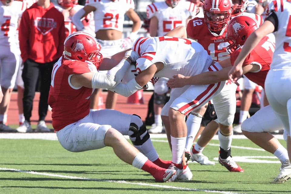 Albany's Zane Waggoner (70) makes a tackle against Muenster during the Region II-2A Division II semifinal.