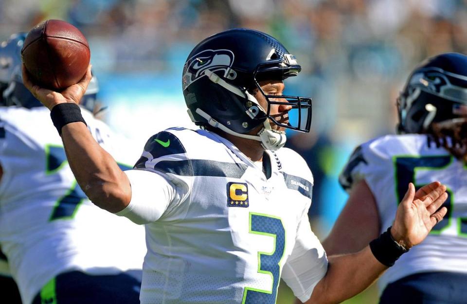 Seattle Seahawks quarterback Russell Wilson drops back to pass to a receiver during first quarter action against the Carolina Panthers at Bank of America Stadium in Charlotte, NC on Sunday, December 15, 2019.