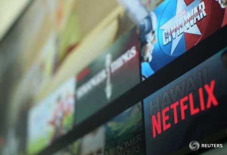 The Netflix logo is pictured on a tevevison in this illustration photograph taken in Encinitas, California