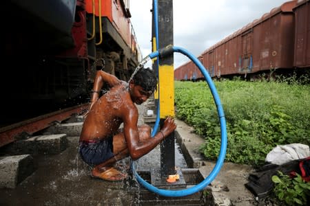 The Wider Image: The Indian children who take a train to collect water