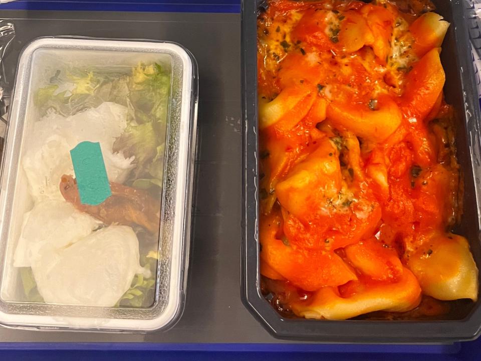 A close-up of the dinner meal that is served in economy.