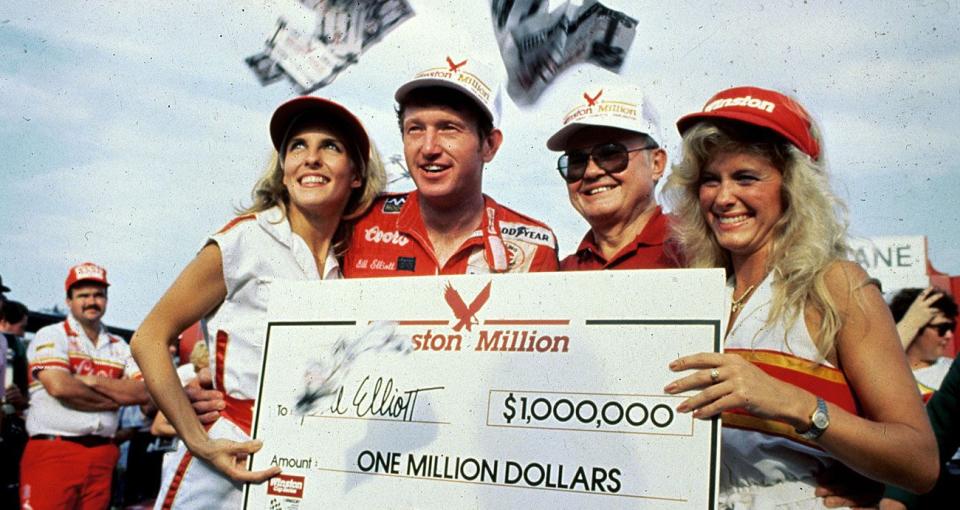 Bill Elliott smiles while his Winston Million check