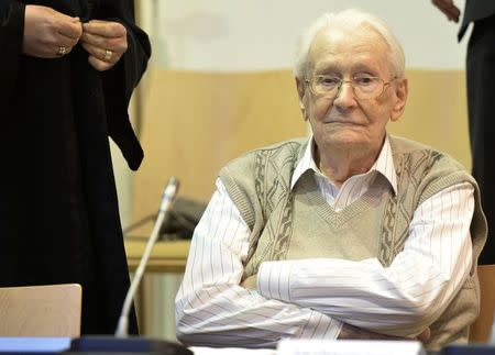 Defendant Oskar Groening awaits the start of his trial in a courtroom in Luneburg April 21, 2015. REUTERS/Julian Stratenschulte