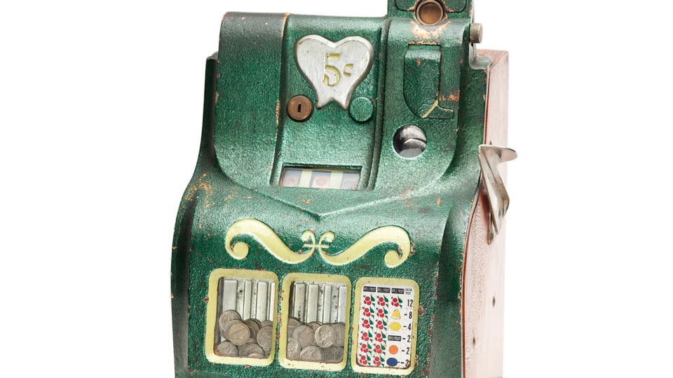 A slot machine kept by its former owners' niece, who recalls playing with it as a child. - Jody Servon and Lorene Delany-Ullman/savedobjectsofthedead.com