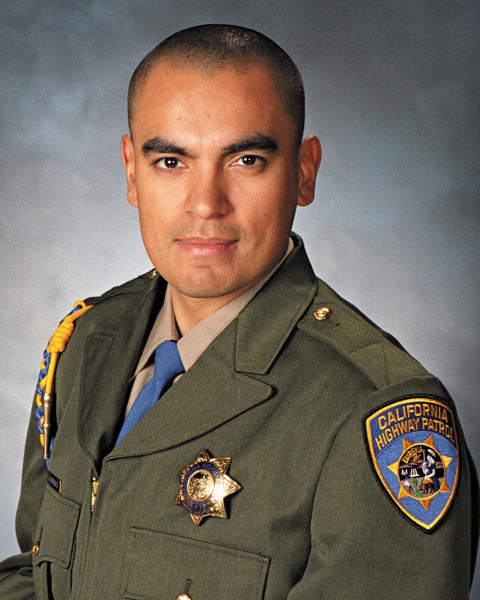 In this undated photo released by the California Highway Patrol is Officer Juan Gonzalez. The California Highway Patrol was mourning the loss of two officers Monday, Feb. 17, 2014, after their squad car flipped over while responding to a multi-vehicle crash. Officers Brian Law and Gonzalez were heading to the crash on state Route 99 near the Central Valley town of Kingsburg, Calif., the CHP said. (AP Photo/California Highway Patrol)