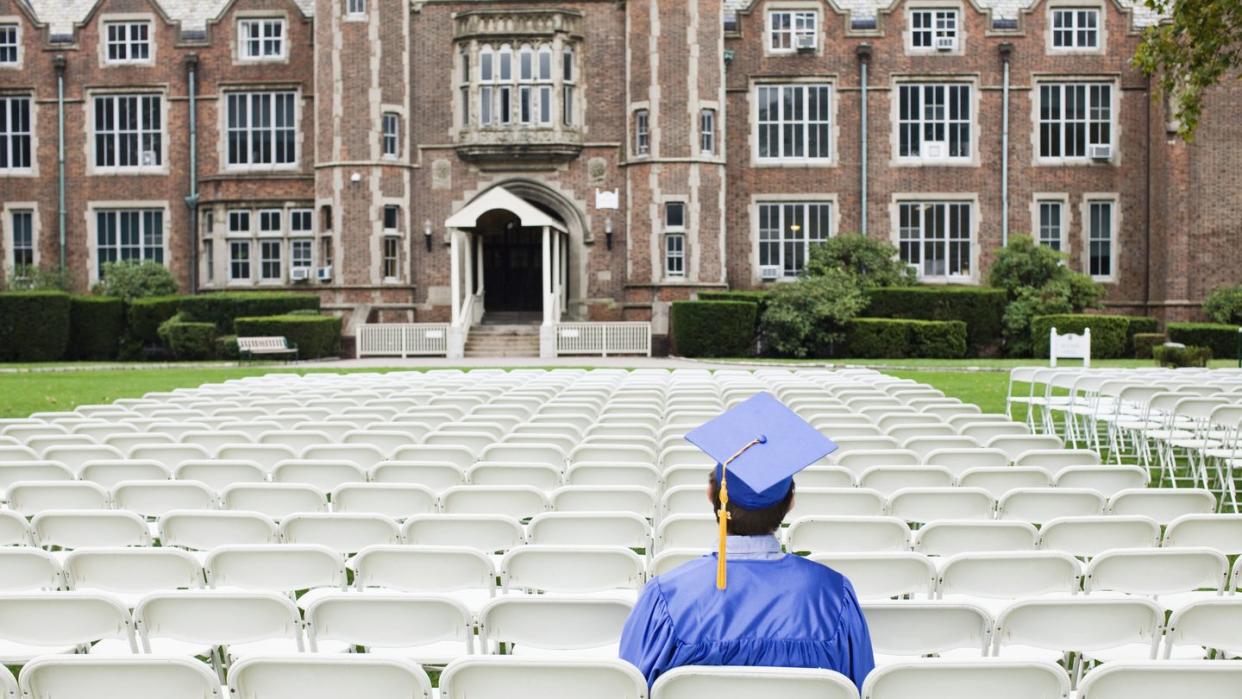 graduate sitting alone