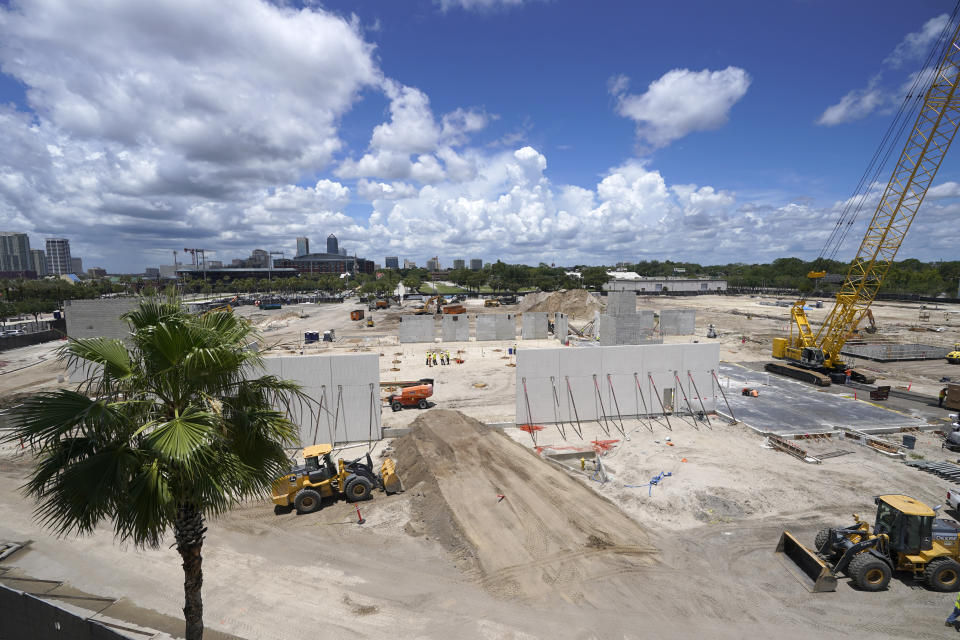 Workers continue construction of the Jacksonville Jaguars Sports Performance Center, Tuesday, May 31, 2022, in Jacksonville, Fla. The center, scheduled to be completed in 2023, includes nearly 130,000 square feet of space that will house new meeting rooms, weight rooms, locker rooms and practice fields. (AP Photo/John Raoux)