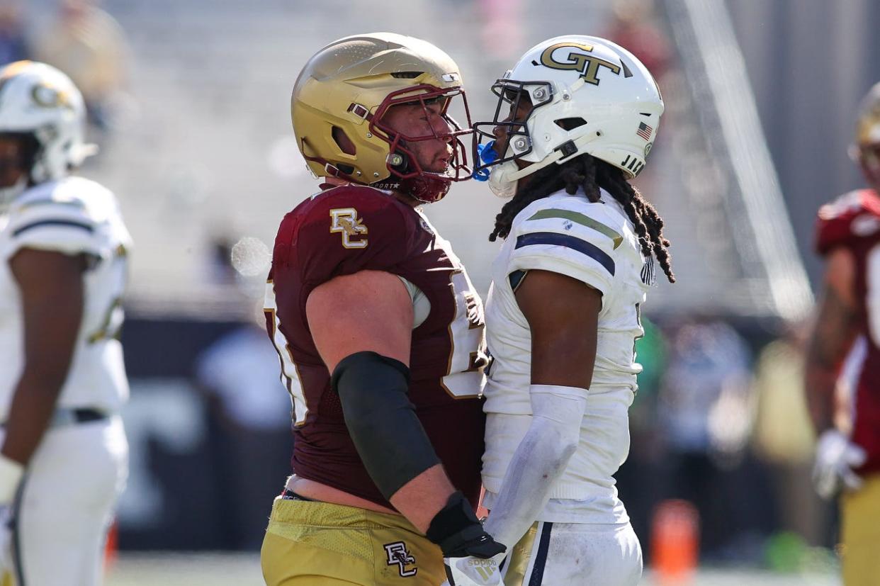 Boston College Eagles offensive lineman Kyle Hergel (60) gets in the face of Georgia Tech Yellow Jackets defensive back LaMiles Brooks.