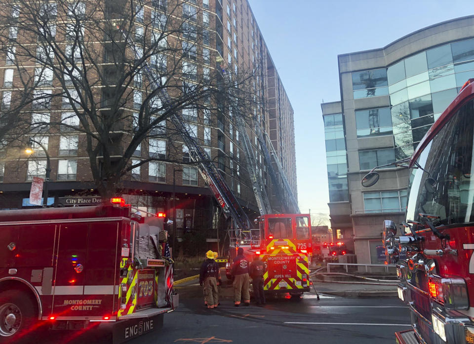 In this photo provided by Montgomery County (Maryland) Fire & Rescue Service, firefighters respond to a fire at a high-rise apartment building, Saturday, Feb. 18, 2023, in Silver Springs, Md. (Montgomery County Fire & Rescue Service via AP)