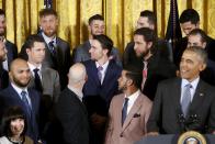 San Francisco Giants outfielder Hunter Pence (top L) reacts to quips about him by U.S. President Barack Obama (bottom R) during a reception for the Giants, Major League Baseball's 2014 World Series champions, in the East Room of the White House in Washington, June 4, 2015. REUTERS/Jonathan Ernst TPX IMAGES OF THE DAY