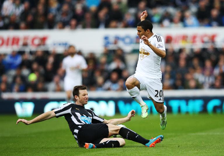 Newcastle head coach John Carver accused defender Mike Williamson, pictured (L) in the match against Swansea, of deliberately getting sent off after his side went down 3-0 at Leicester City in the Premier League