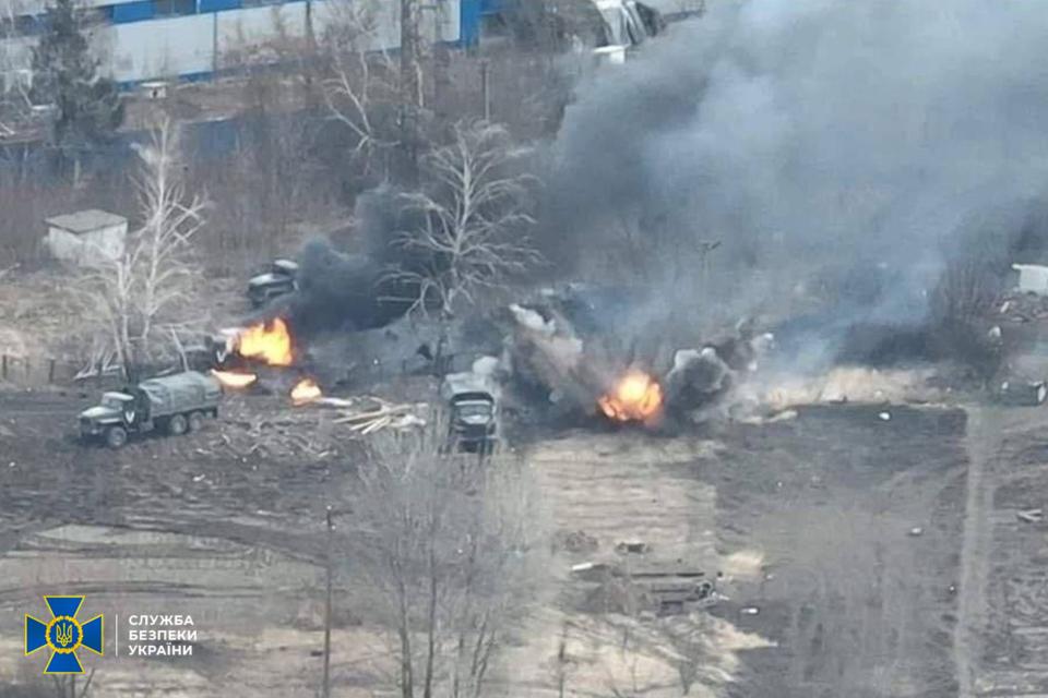 Purported Russian vehicles burn outside Kyiv in this photo provided by the Ukrainian government.