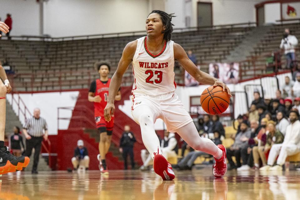 Lawrence North High School junior Azavier Robinson (23) brings the ball up court during the second half of a Boysâ€™ Marion County Basketball Tournament semi-final game against North Central High School, Friday, Jan. 12, 2024, at Southport High School. Lawrence North won, 73-53.