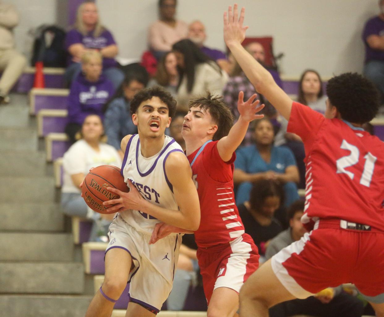 Topeka West’s Jalen Foy drives to the rim against Shawnee Heights on Tuesday, Feb. 6. The Thunderbirds defeated the Chargers 58-30.