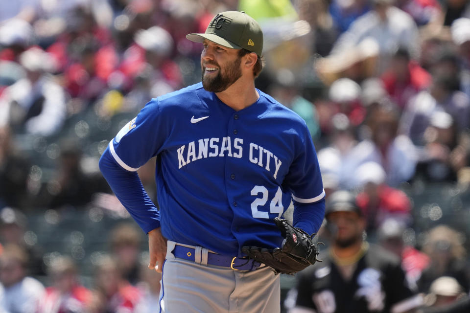 Kansas City Royals starting pitcher Jordan Lyles looks at the scoreboard during the first inning of a baseball game against the Chicago White Sox in Chicago, Saturday, May 20, 2023. (AP Photo/Nam Y. Huh)