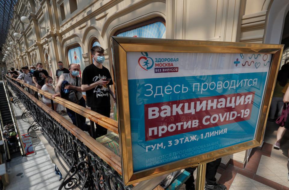 Russian people stand in line waiting to receive an injection of Russia’s Sputnik V (EPA)