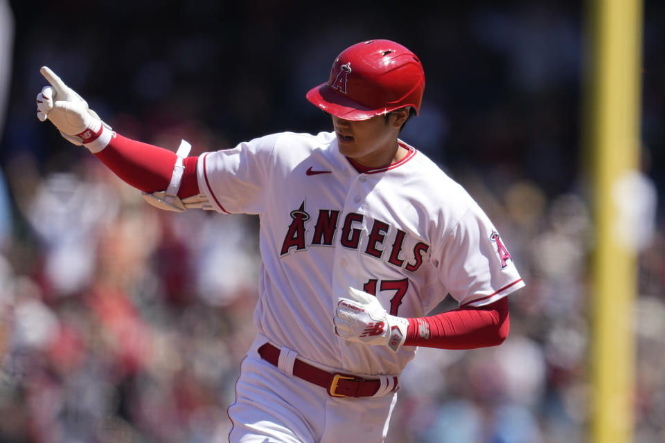 Los Angeles Angels' Shohei Ohtani celebrates has rounds the bases after his two-run home run during the third inning of a baseball game against the Toronto Blue Jays Sunday, April 9, 2023, in Anaheim, Calif. (AP Photo/Marcio Jose Sanchez)