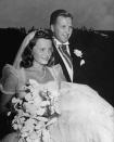 <p>This 1940 wedding was a HUGE deal—in fact, a hilariously old-time-y video about it can be found on <a href="https://www.youtube.com/watch?v=xLoEvkEMZCk" rel="nofollow noopener" target="_blank" data-ylk="slk:YouTube;elm:context_link;itc:0;sec:content-canvas" class="link ">YouTube</a>. </p><p>Henry Ford II and Anne McDonnell were married in Long Island, and the church was swarming with hundreds of uninvited guests hoping for a glimpse of the bride and groom. Anne's dress is ever-so lovely, with sheer cap sleeves and a giant skirt.<br><br></p>