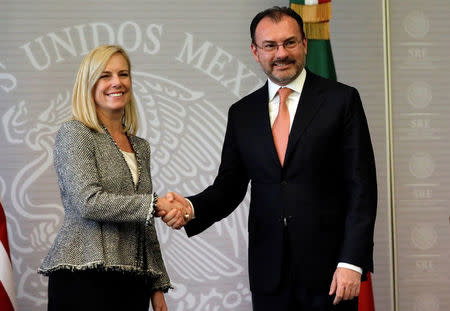 U.S. Homeland Security Secretary Kirstjen Nielsen shakes hands with Mexico's Foreign Minister Luis Videgaray after delivering a joint message in Mexico City, Mexico March 26, 2018. REUTERS/Henry Romero