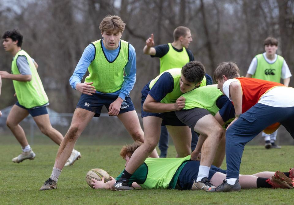 CBA TJ Meehan plans his move as he takes ball out of a ruk. Christian Brothers Academy Rugby team practices as they prepare for a 10 day trip to Ireland over Spring Break. Practice was in Lincroft on May 28, 2023. 