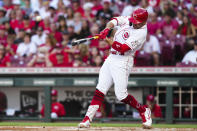 Cincinnati Reds' Joey Votto hits a two-run home run against the Baltimore Orioles during the first inning of a baseball game Friday, July 29, 2022, in Cincinnati. (AP Photo/Jeff Dean)