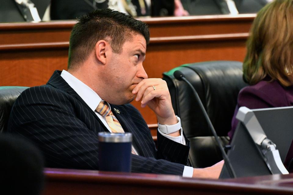 Louisville Metro Council District 19 Representative Anthony Piagentini listens as the charging documents are read into the record during the Metro Council meeting in the Louisville Metro Council chambers, Thursday, Nov., 30 2023 in Louisville Ky.