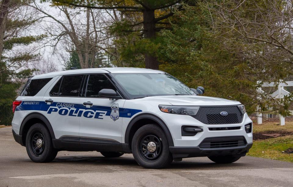 A Carmel Police Department officer uses his vehicle Friday, Feb. 10, 2023, to block Brendun Orchard Lane from traffic. The road leads back to the residence of former U.S. Vice President and Indiana Gov. Mike Pence's home, which has a Zionsville address. 