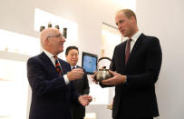 Britain's Prince William is presented with a copper kettle by Michael Houlihan, Director General of Japan House, during the official opening of Japan House in London, Britain, September 13, 2018. Tim P. Whitby/Pool via REUTERS