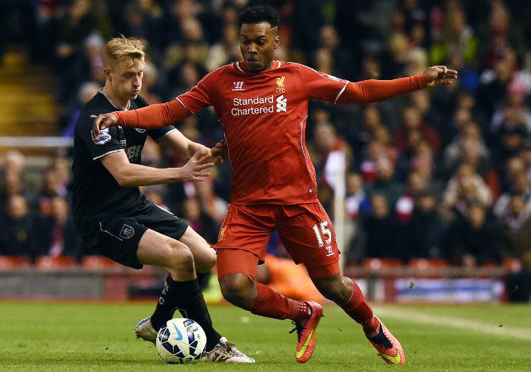 Burnley's English defender Ben Mee (L) vies with Liverpool's English striker Daniel Sturridge during their English Premier League football match in Liverpool, England on March 4, 2015