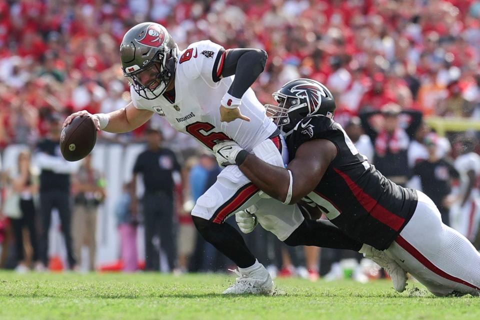 Tampa Bay Buccaneers quarterback Baker Mayfield (6) is sacked by Atlanta Falcons defensive tackle David Onyemata (90) in the fourth quarter at Raymond James Stadium.