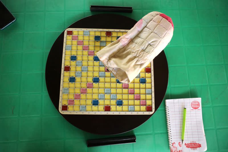 A scrabble board, pouch and writing materials are seen set out on a table during a scrabble competition in Abuja
