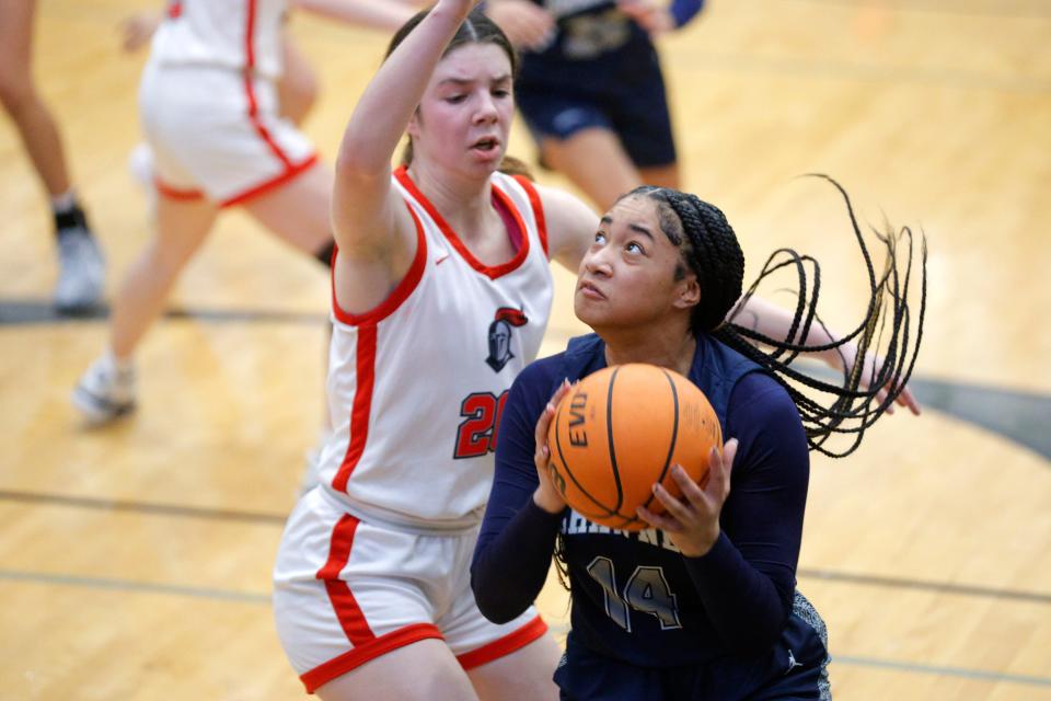 Shawnee's Chrishelle Milum Puts up a shot beside Crossings Christian's Allison Hickey during a girls high school basketball game between Crossings Christian and Shawnee in Oklahoma City, Friday, Feb. 2, 2024.