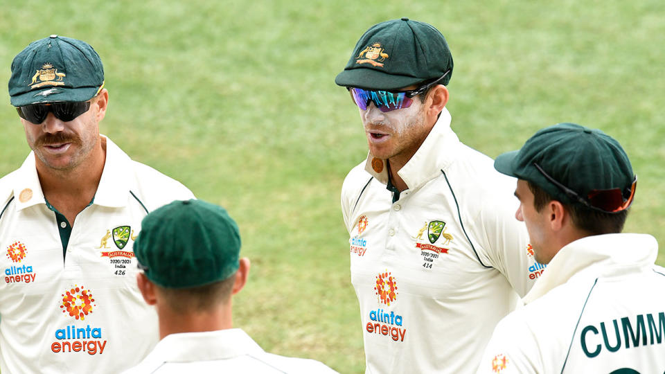 Aussie captain Tim Paine is pictured here in discussions with his Test teammates.