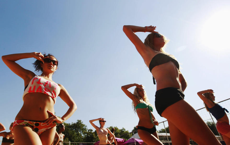 Dancers rehearse their performances for the London 2012 Olympic Beach Volleyball matches at the practice facility near to Horse Guards Parade in London