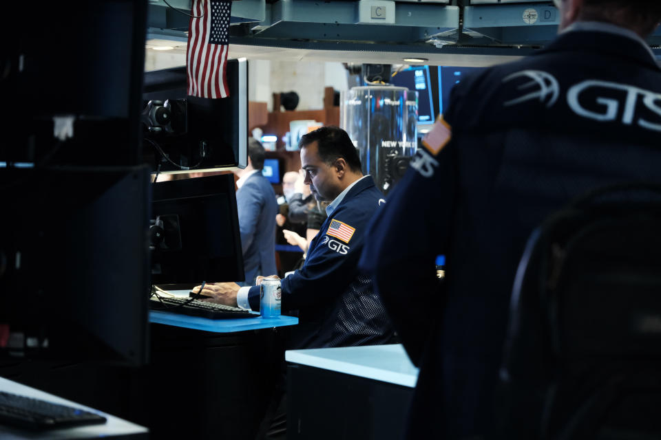 NEW YORK, NEW YORK - MARCH 11: Traders work on the floor of the New York Stock Exchange (NYSE) on March 11, 2022 in New York City. The Dow Jones Industrial Average was up over 200 points in morning trading on the last day of a volatile week for global markets. (Photo by Spencer Platt/Getty Images)