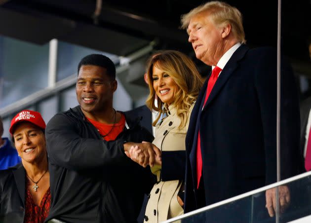 Herschel Walker interacts with former President Donald Trump prior to Game 4 of the World Series between the Houston Astros and the Atlanta Braves on Oct. 30, 2021, in Atlanta, Georgia. (Photo: Michael Zarrilli via Getty Images)