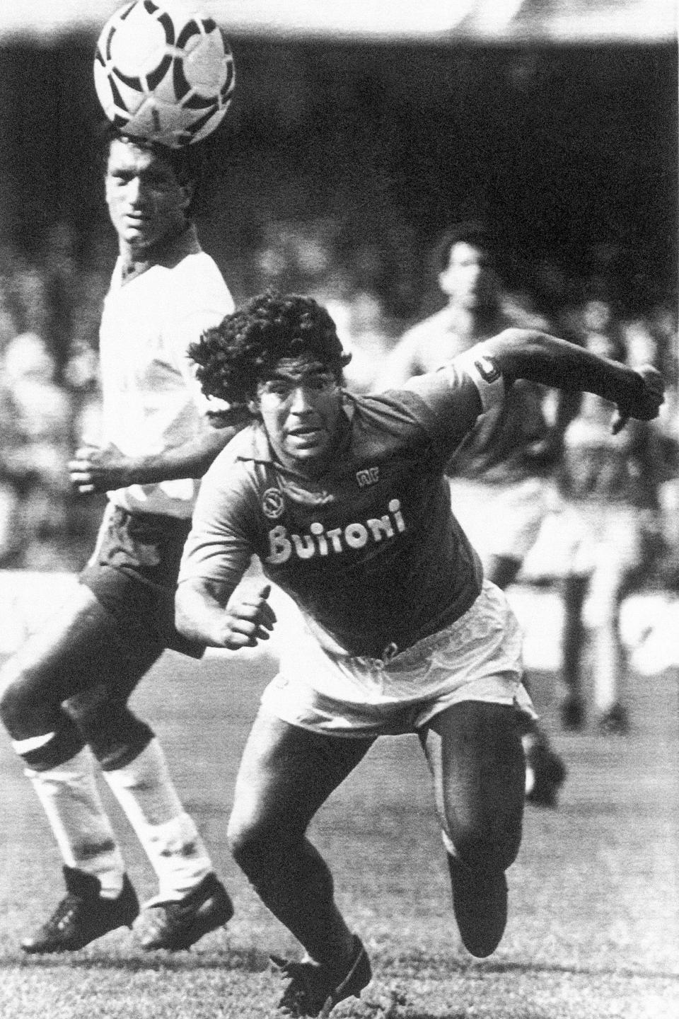 FILE - Argentine soccer superstar Diego Armando Maradona runs for the ball during a Serie A match between Napoli and Fiorentina in Naples, Italy, May 10, 1987. The legend of Diego Maradona at Napoli hovers over the current team’s Italian league title, which was sealed Thursday, May 4, 2023. The Argentina standout holds saint-like status in Naples 2 ½ years after his death and more than three decades after he led Napoli to its first two Serie A titles. (AP Photo/Massimo Sambucetti, File)