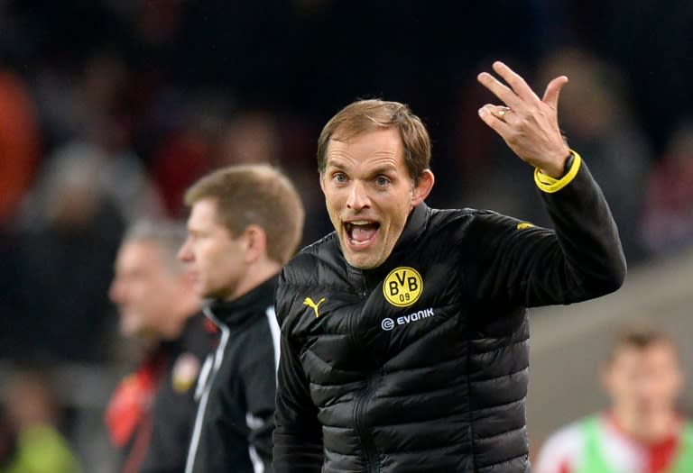 Dortmund's head coach Thomas Tuchel reacts as his team scores during the German Cup quarter final football match at VfB Stuttgart on February 9, 2016