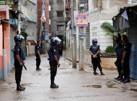 Security personnel block a road near the site of a police operation on militants on the outskirts Dhaka, Bangladesh, July 26, 2016. REUTERS/Mohammad Ponir Hossain.