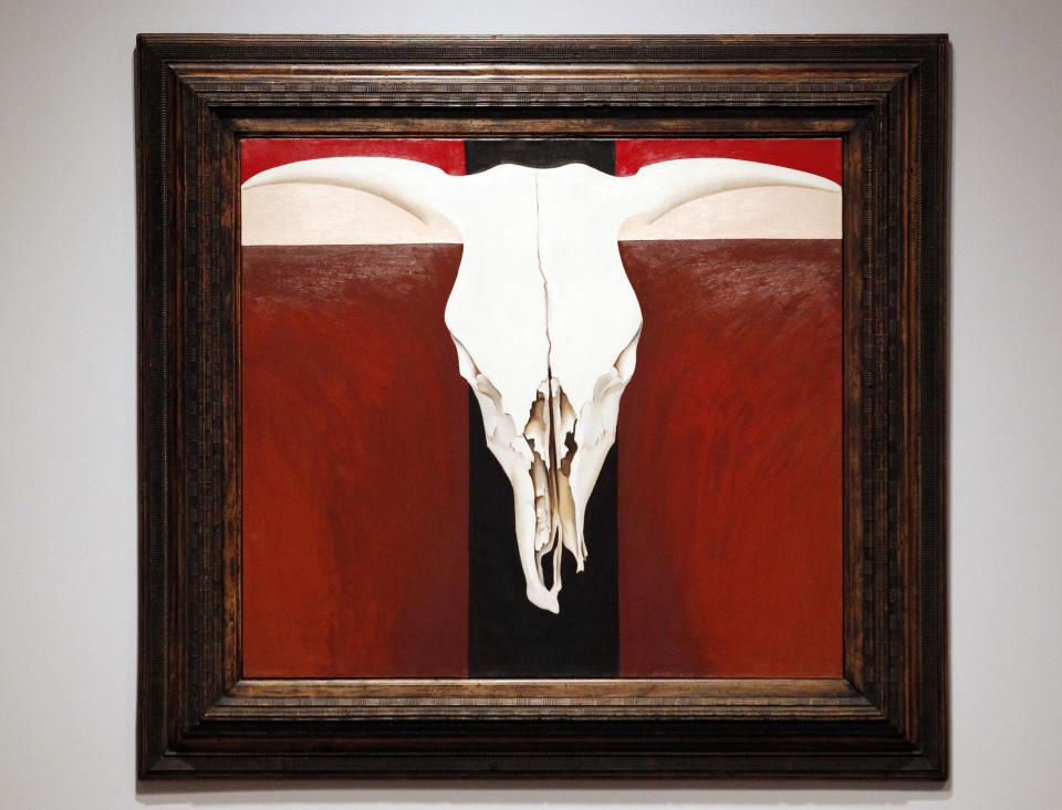 In this photo taken Tuesday, Oct. 9, 2012, an oil painting by Georgia O'Keeffe (Cow's Skull on Red) is seen as part of one of two new exhibits featuring art exclusively by women at the Seattle Art Museum, in Seattle. Included in the exhibition is the only U.S. stop for an exhibit from the Pompidou Center in Paris, home of the modern art museum there, of painting, sculpture, drawing, photography and video. The exhibit runs through Jan. 13, 2013. (AP Photo/Elaine Thompson)