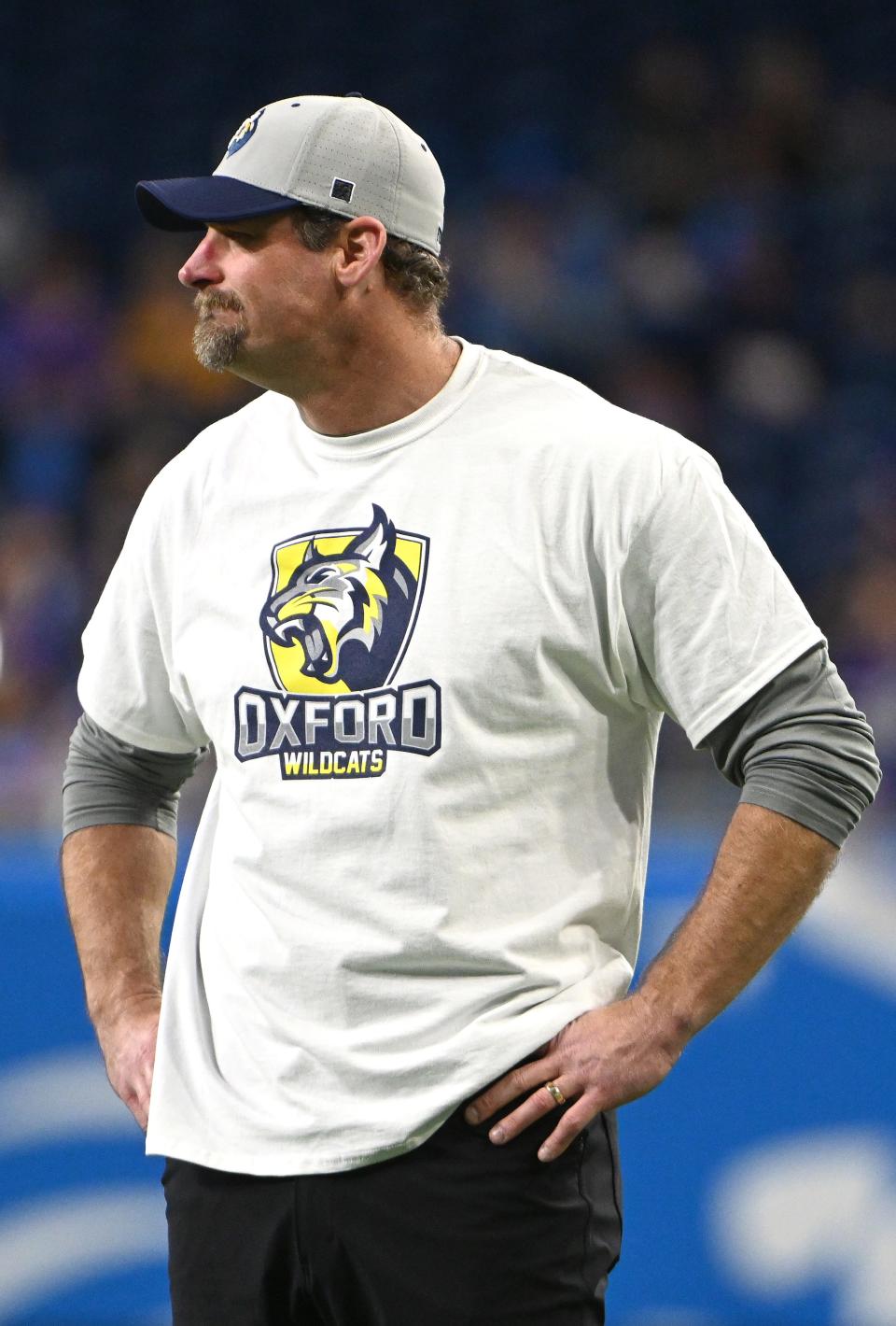 Dan Campbell looks on wearing an Oxford High School shirt before the game Sunday.