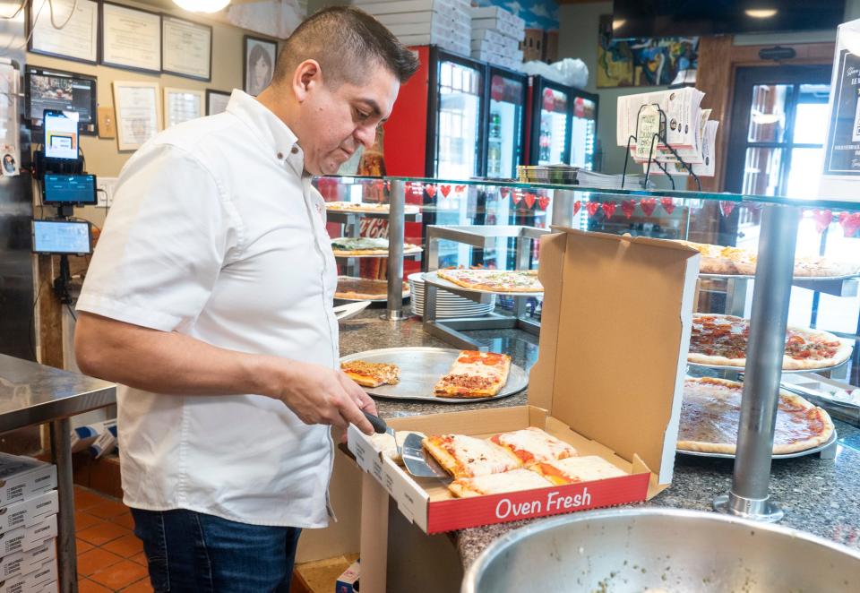 Lou Vera, owner of The Valley Pizza, gets a pizza order ready for pick-up in Bensalem on Wednesday, Jan. 17, 2024.

Daniella Heminghaus | Bucks County Courier Times