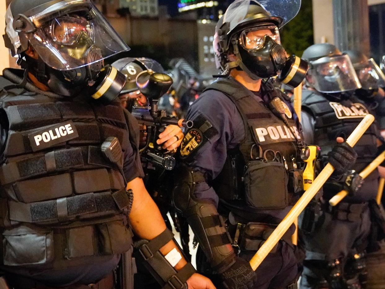 Louisville Metro police officers during a protest against the deaths of Breonna Taylor by Louisville police and George Floyd by Minneapolis police, in Louisville, Kentucky, on May 29, 2020.