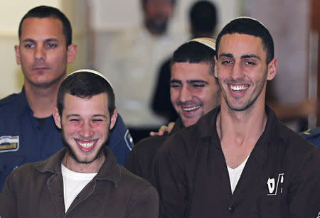 Israeli prison guards escort far-right activists Yitzhak Gabai, Nahman Twito and Shlomo Twito at Jerusalem District Court December 15, 2014. REUTERS/Ammar Awad