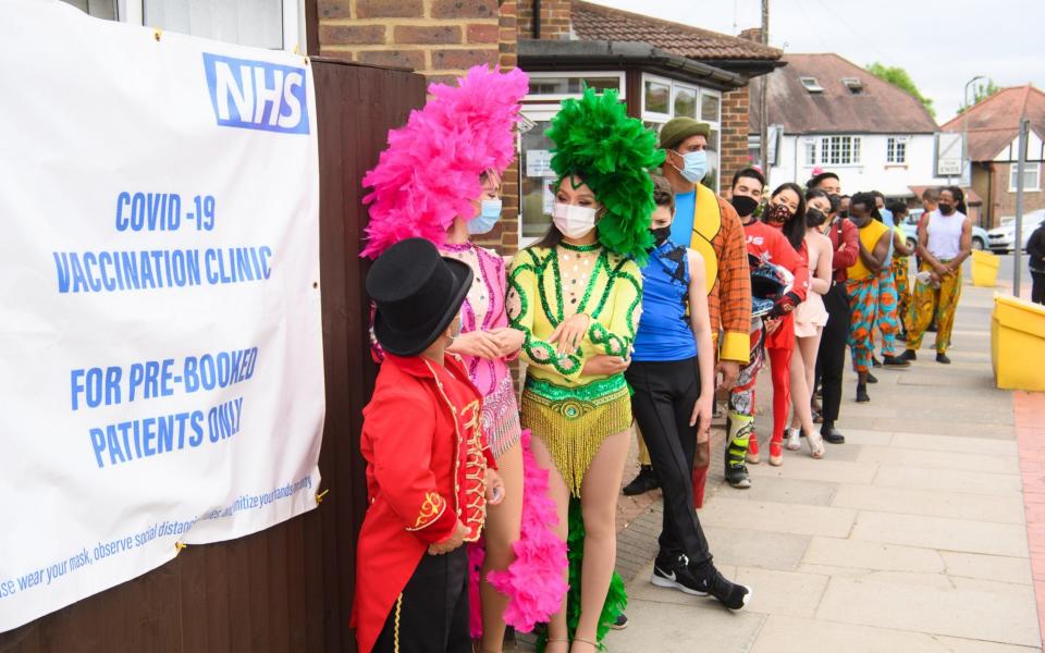 Zippos circus performers await their Covid vaccinations in Finchley, north London, under the Vaxi Taxi project to get jabs to those who may fall through the cracks of the regular rollout - Matt Crossick/Empics