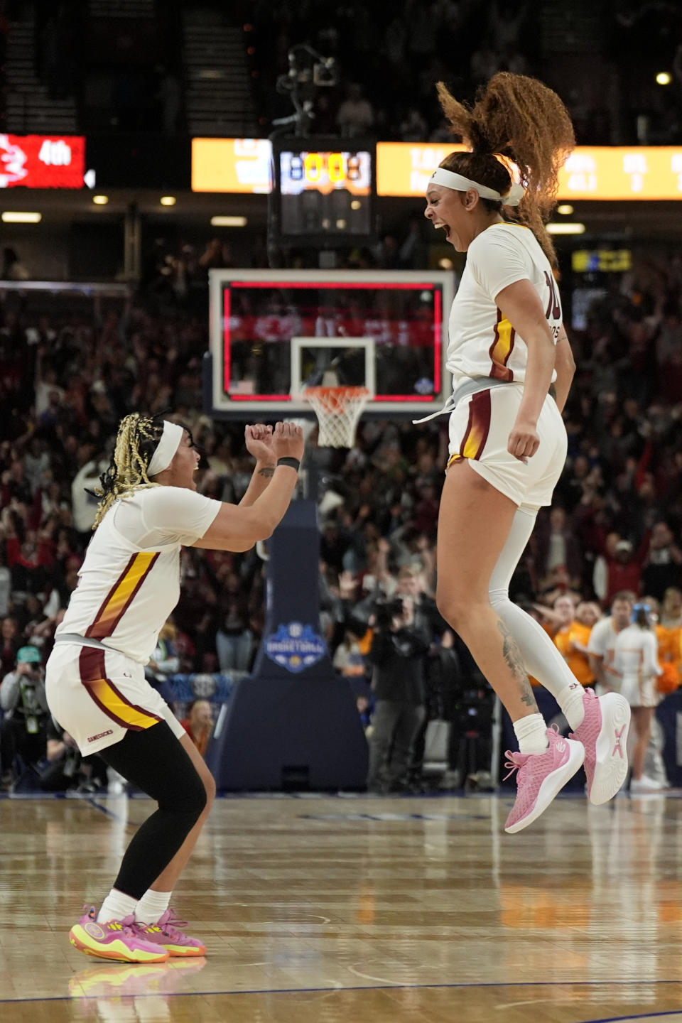 South Carolina center Kamilla Cardoso, right, celebrates after scoring the game winning basket with guard Te-Hina Paopao against Tennessee during the second half of an NCAA college basketball game at the Southeastern Conference women's tournament Saturday, March 9, 2024, in Greenville, S.C. (AP Photo/Chris Carlson)