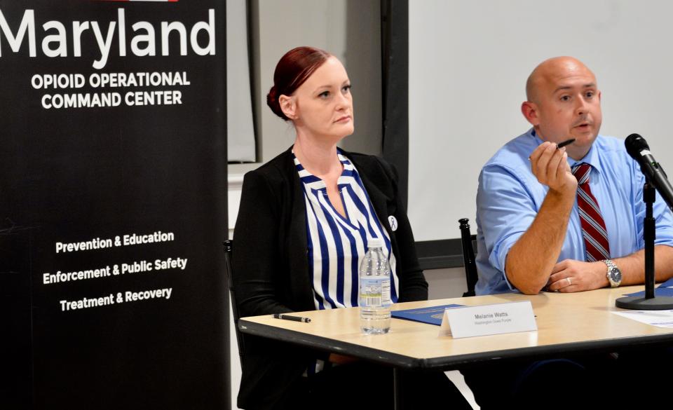 Detective Lt. Joshua McCauley, with the Washington County Sheriff's Office, addresses attendees at the Community Overdose Action Town Hall in downtown Hagerstown on Wednesday night. Next to McCauley is panelist Melanie Watts, a peer support specialist and co-chair of Washington Goes Purple.